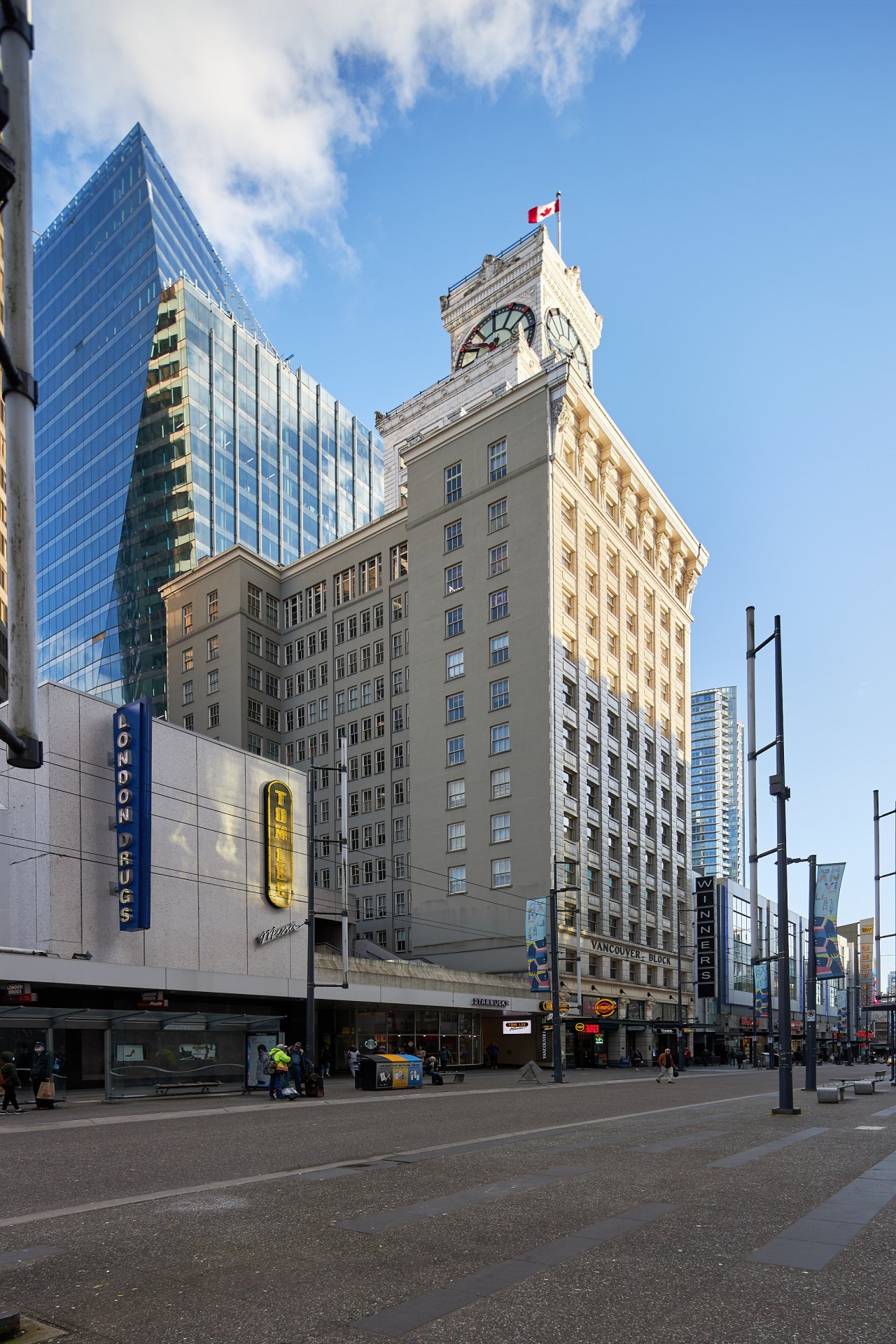The Vancouver Block building on Granville Street, its heritage clock tower against a clear sky
